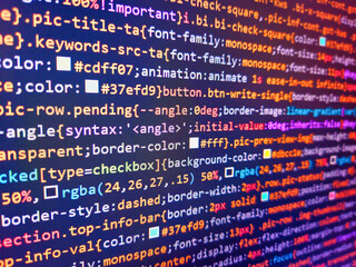 Colorful programming php and html code on a monitor. Computer source code in blue. Blue software...