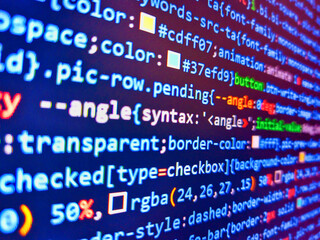 Obraz premium Blue screen of death on the monitor. Encrypted data. Software development monitor screen background. Closeup photo. Online data security concept. Monitor technology concept. Remote work search.