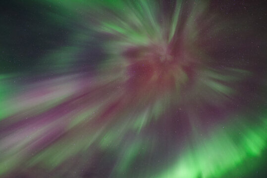 Pink, red, green and purple northern lights, aurora borealis, auroral corona in Tromso, Norway - Powered by Adobe