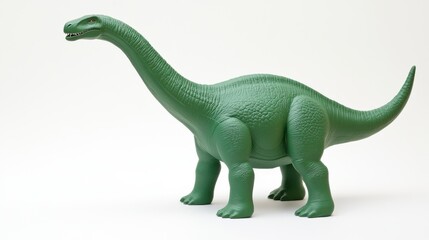 Green plastic toy brachiosaurus on white background