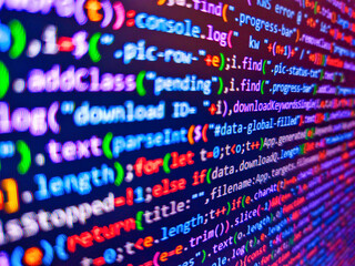 Compressed javascript code on computer screen. Pixelated data stream on digital interface with binary code, encryption concept, and glowing dots. Color coding on screen. Binary background.