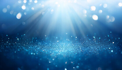Niebieskie tło bokeh. Brokat,  świąteczne, boże narodzenie. Puste miejsce, promienie światła