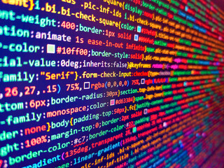 Background of program code. Computer script. Programming code on computer screen. Sequence of numbers with bright colors on a black background. Computer html code on screen. Code on monitor.