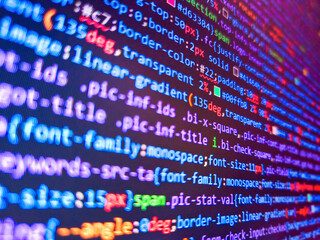 Remote work search. Web server data on a monitor. Software developer programming code. Work of software developer programmer on desktop screen closeup. Coding concept. Abstract code background.
