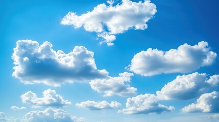 Fototapeta premium Fluffy White Clouds Against a Vibrant Blue Sky