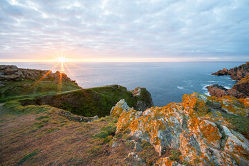 Sunset at Pen Men on the island of Groix, in the Morbihan department, Brittany region, France,...