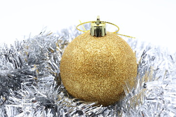 Glitter decoration for Christmas. Shiny golden x-mas ball. Close up photo.