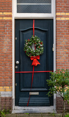festive wreath front door Netherlands red Christmas New Year