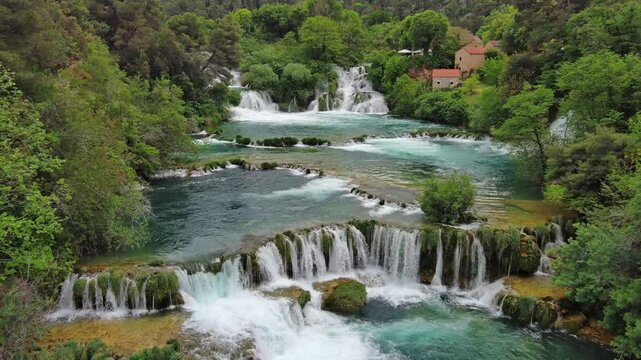 Aerial view of beautiful Krka Waterfalls in Krka National Park, green foliage and turquoise water, Croatia, 4k