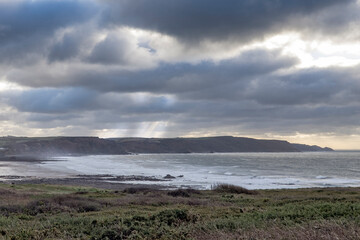 December storm clouds at Widemouth Bay Cornwall