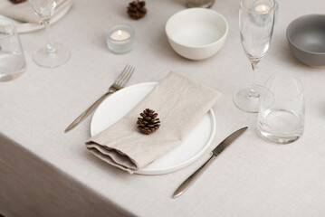 Minimalist Christmas table styling for celebrating Christmas or New Year's eve. Neutral Christmas...