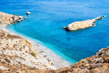 View of beautiful Katergo beach and blue sea from high rock cliff, Folegandros island, Cyclades,...
