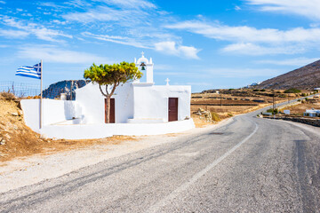Small chapel along scenic road and mountain landscape, Folegandros island, Cyclades, Greece