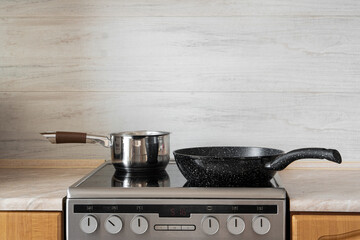 A saucepan stands on the hob in the kitchen