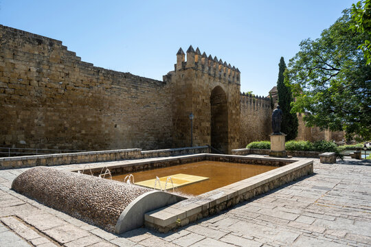 Córdoba, Spain - August 17, 2024: The Almodóvar gate with the fountain in the foreground