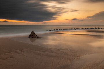 Sunset on the beach with sandcastle