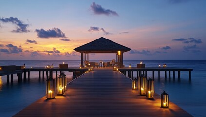Obraz premium A wooden pier with a gazebo and lanterns lit up at sunset