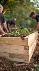 Fototapeta premium Building a Sustainable Future: Volunteers Constructing a Compost Bin in a Flourishing Garden