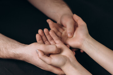 hand massage, close-up of the hands of the massage therapist and the client, creating a feeling of care and gentle touch. concept for massage services, spa treatments, hand care and general relaxation