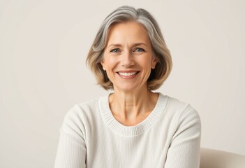 Fototapeta premium Warm and gentle half-length portrait of a middle-aged woman