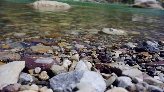 Water flowing on the Ganges river bank in Rishikesh