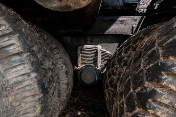 Close-Up View of Machinery Components Beneath Tires
