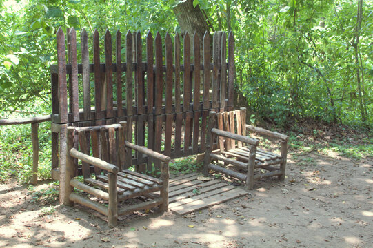 Rustic Outdoor Seating with Wooden Logs in Natural Surroundings