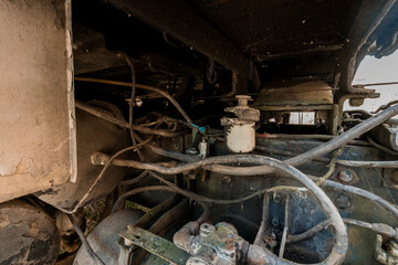 Intricate Details of an Aging Engine Underneath a Vehicle
