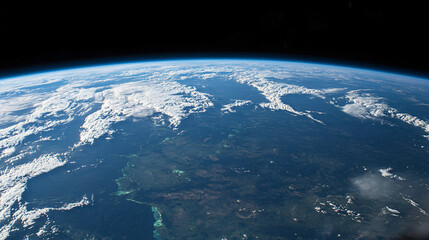Fototapeta premium A peaceful Earth view from high orbit, showing white clouds and green-blue land masses.
