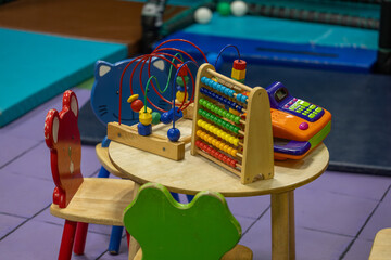 kids table and chairs with toys on top of the table