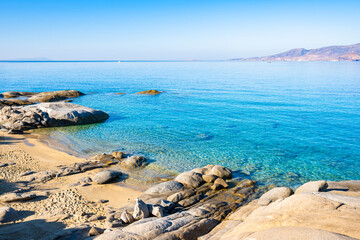 View of rocks in sea on sandy Agia Anna beach, Naxos island, Cyclades, Greece
