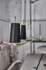 Black Thread Cones on Industrial Sewing Machine
