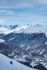 Fototapeta premium Winter snow landscape of a valley in the high alpine mountains of Switzerland