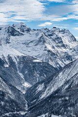 Fototapeta premium Winter snow landscape of a valley in the high alpine mountains of Switzerland