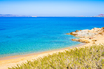 Wonderful sandy beach of Orkos bay and calm azure sea water