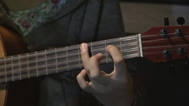 Musician playing tiple, a Latin American - Andean string instrument. Tiplista, tiple