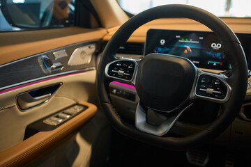 Naklejka premium Detailed shot of a sleek black and silver alloy wheel on a motor vehicle