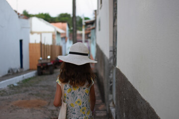 Little girl walking on the street