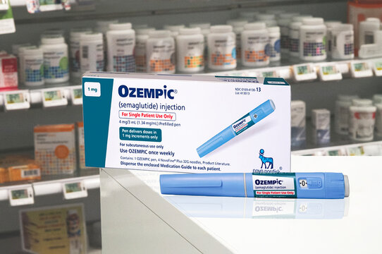 Ozempic Insulin box and injection pen or insulin cartridge pen for diabetes patients from Novo Nordisk. Blurred pharmacy background. Copenhagen, Denmark - November 21, 2024.