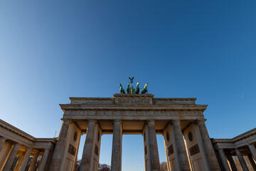 Obraz premium Brandenburg Gate or Brandenburger Tor at midday, Berlin, Germany. Day of German Unity Celebrations