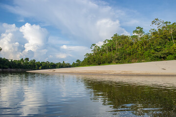 IGAPOS OF THE NANAY RIVER, BLACK WATERS THAT REFLECT THE CLOUDS ON THEIR SURFACE