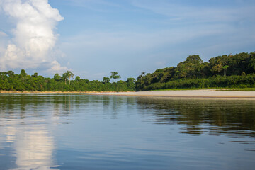 IGAPOS OF THE NANAY RIVER, BLACK WATERS THAT REFLECT THE CLOUDS ON THEIR SURFACE