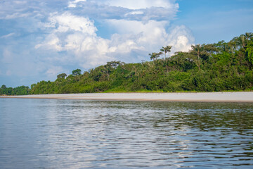 IGAPOS OF THE NANAY RIVER, BLACK WATERS THAT REFLECT THE CLOUDS ON THEIR SURFACE