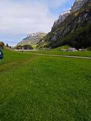 A clear lake in a swiss alp mountain during a cloudy evening in september