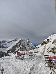 Snowy Swiss alps mountains during a cloudy autumn day