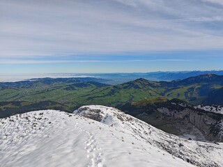 Snowy Swiss alps mountains during a cloudy autumn day