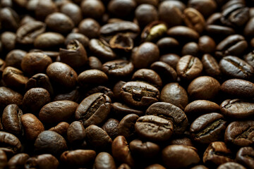 Close-up roasted coffee beans brown texture background macro caffeine beverage ingredient aromatic...
