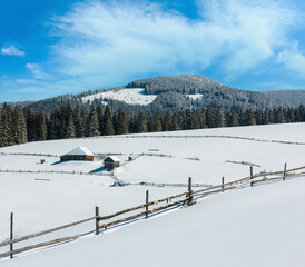 Winter snowy mountains, and lone farmhouse