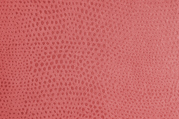Fototapeta premium Cloth structure of jacquard red fabric with abstract shabby spotted embossed texture closeup, macro. Upholstery, decorative cloth structure, home decor canvas. Background, backdrop, wallpaper.