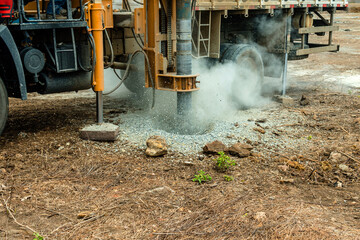In an outdoor setting, this powerful auger drilling rig is captured in full operation, exemplifying...